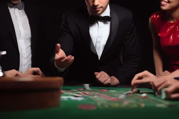 A glowing roulette wheel with cascading chips, symbolizing the engaging live and instant-win games available on MC888C.